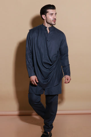 Grey short drape kurta shirt with narrow pants.