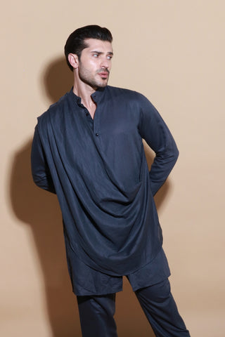 Grey short drape kurta shirt with narrow pants.