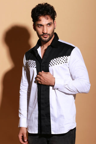 White shirt with black panel and stud detailing.