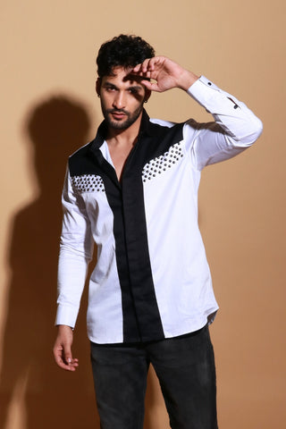 White shirt with black panel and stud detailing.