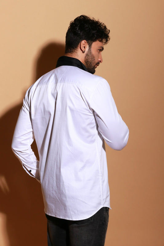 White shirt with black panel and stud detailing.