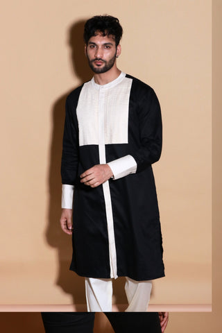 Black and Cream tuxedo pleated mid length kurta with narrow pants.