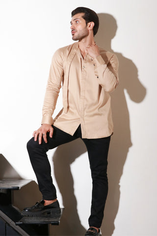 Beige full sleeve shirt with half flap feature.