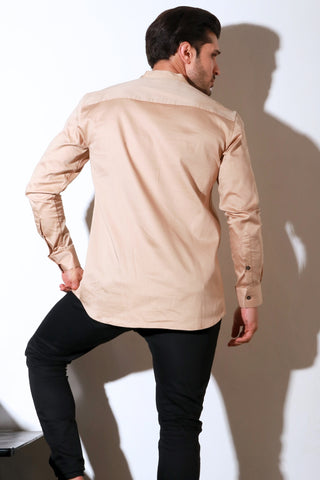 Beige full sleeve shirt with half flap feature.