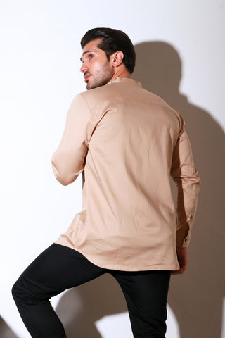 Beige full sleeve shirt with half flap feature.