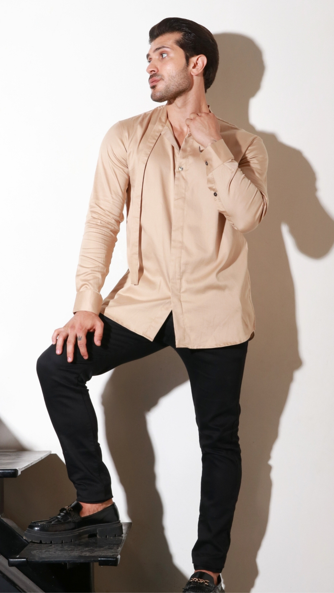 Beige full sleeve shirt with half flap feature.