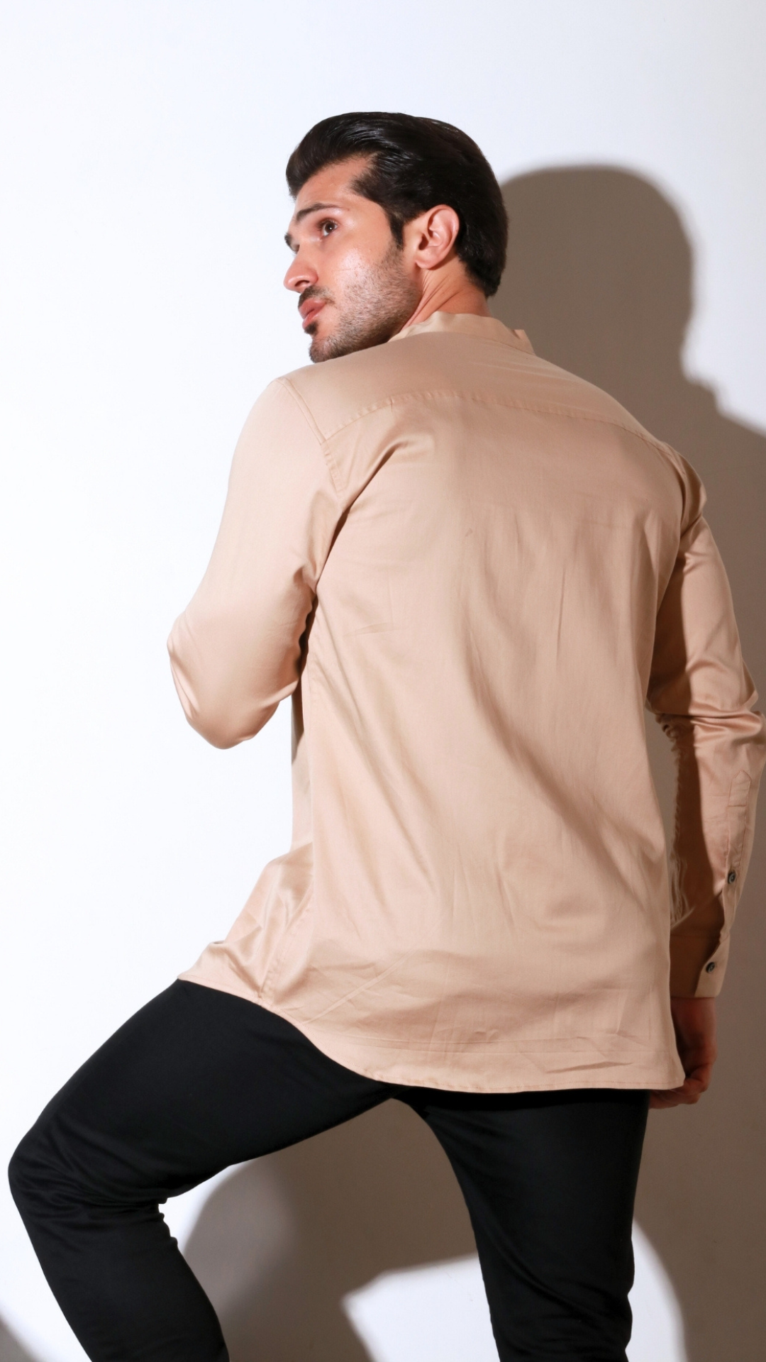 Beige full sleeve shirt with half flap feature.
