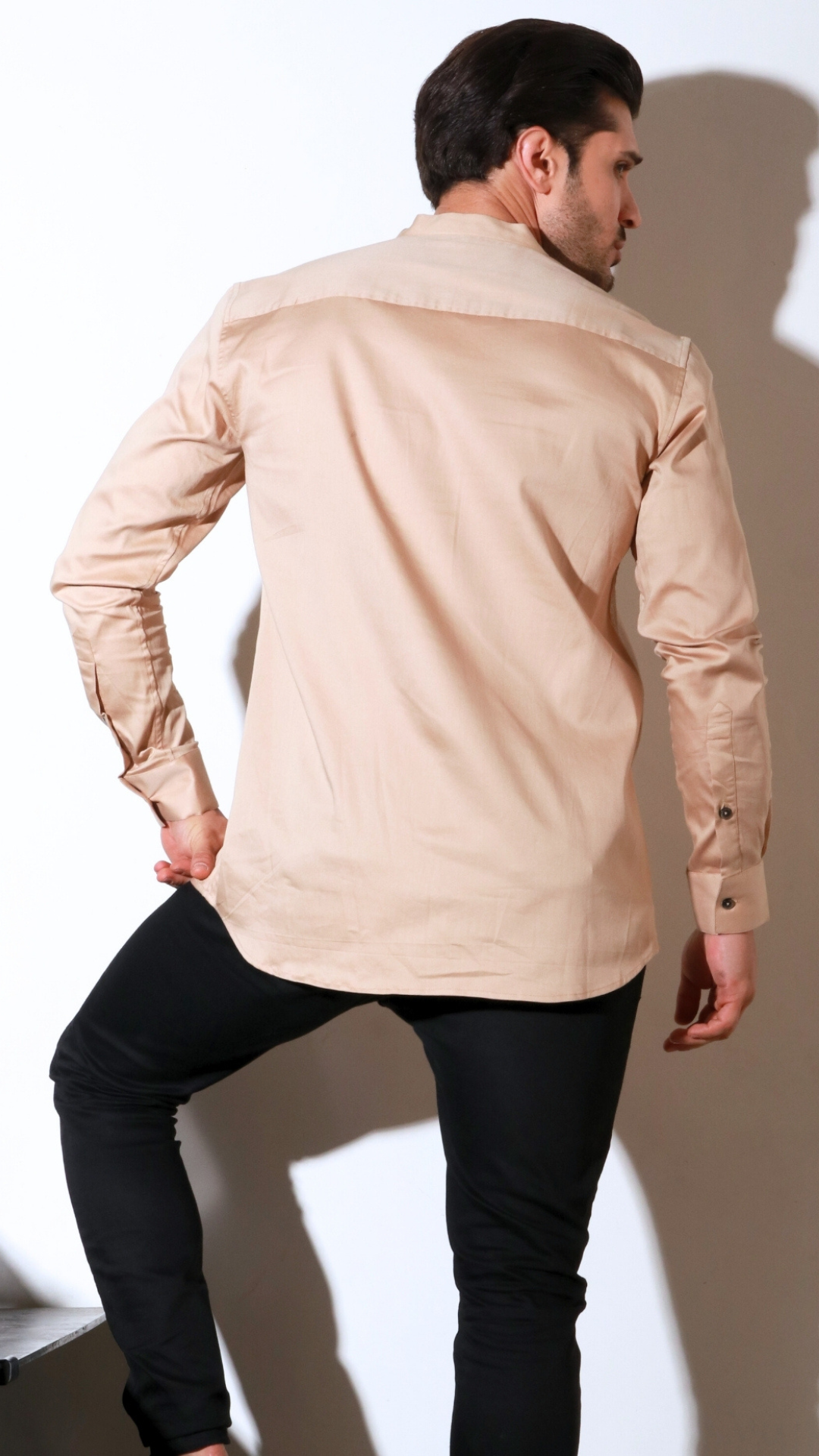 Beige full sleeve shirt with half flap feature.