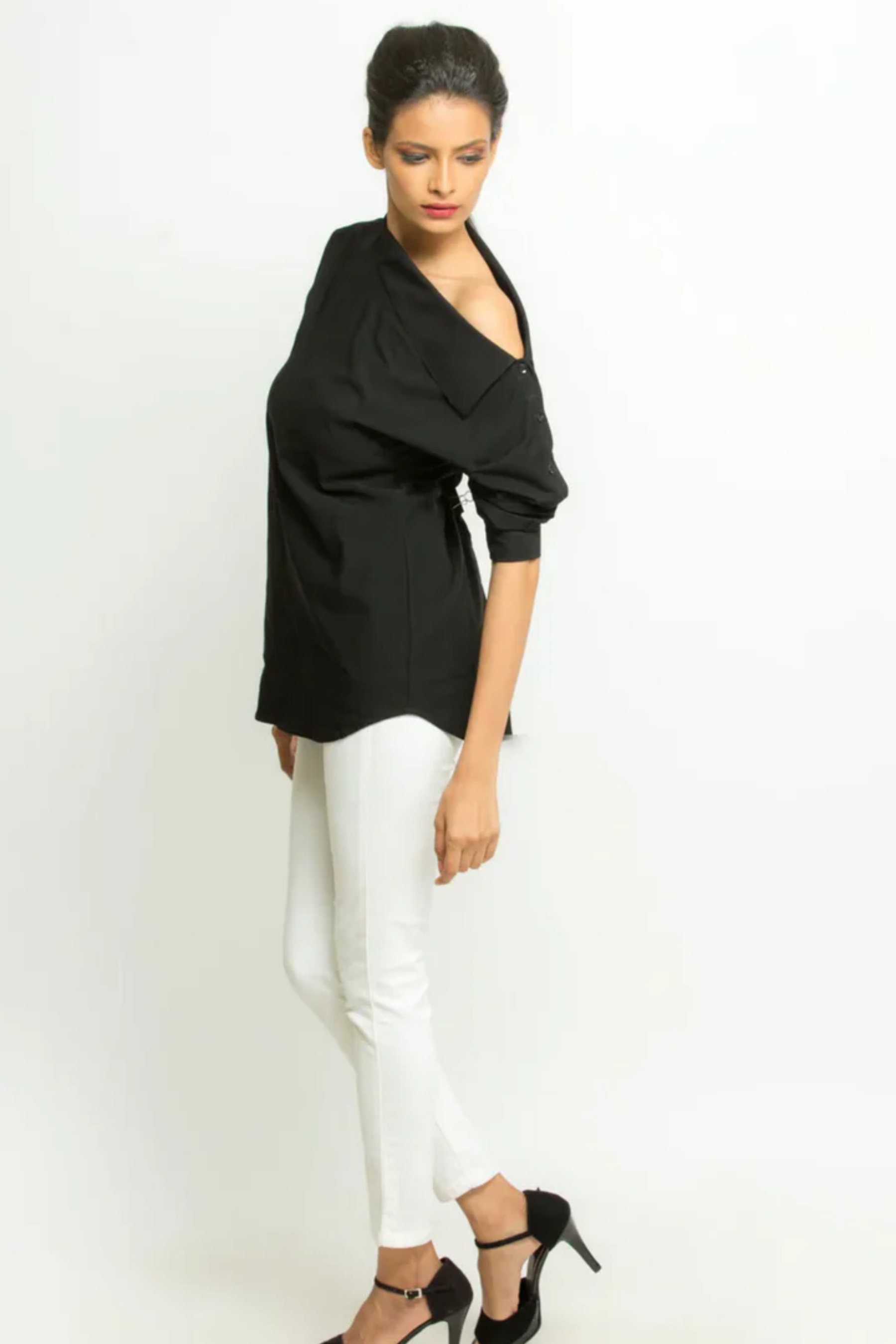 Black off-shoulder shirt features full sleeves, statement collars and button closure.