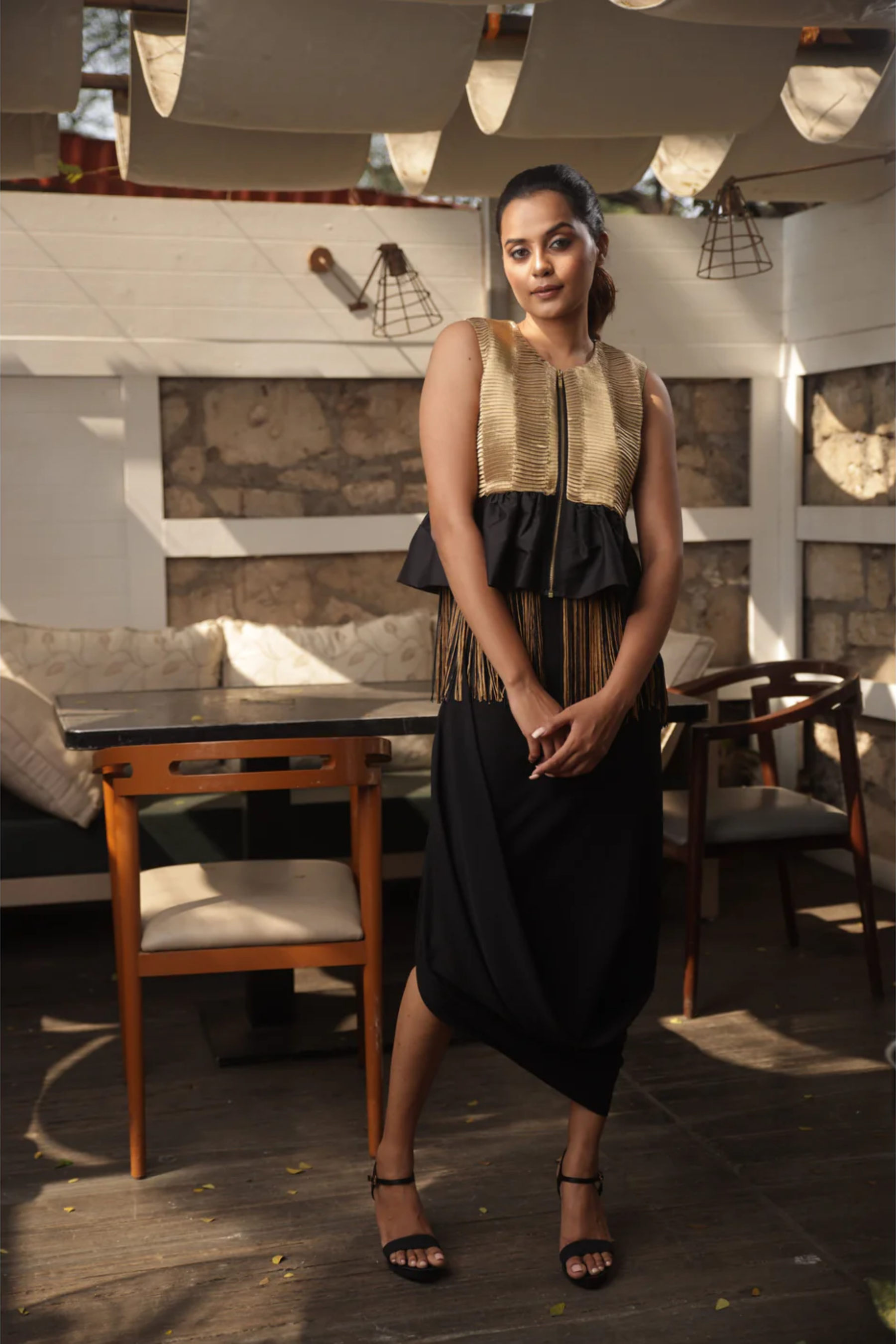 Gold tissue bolero jacket top with black and gold tassels.