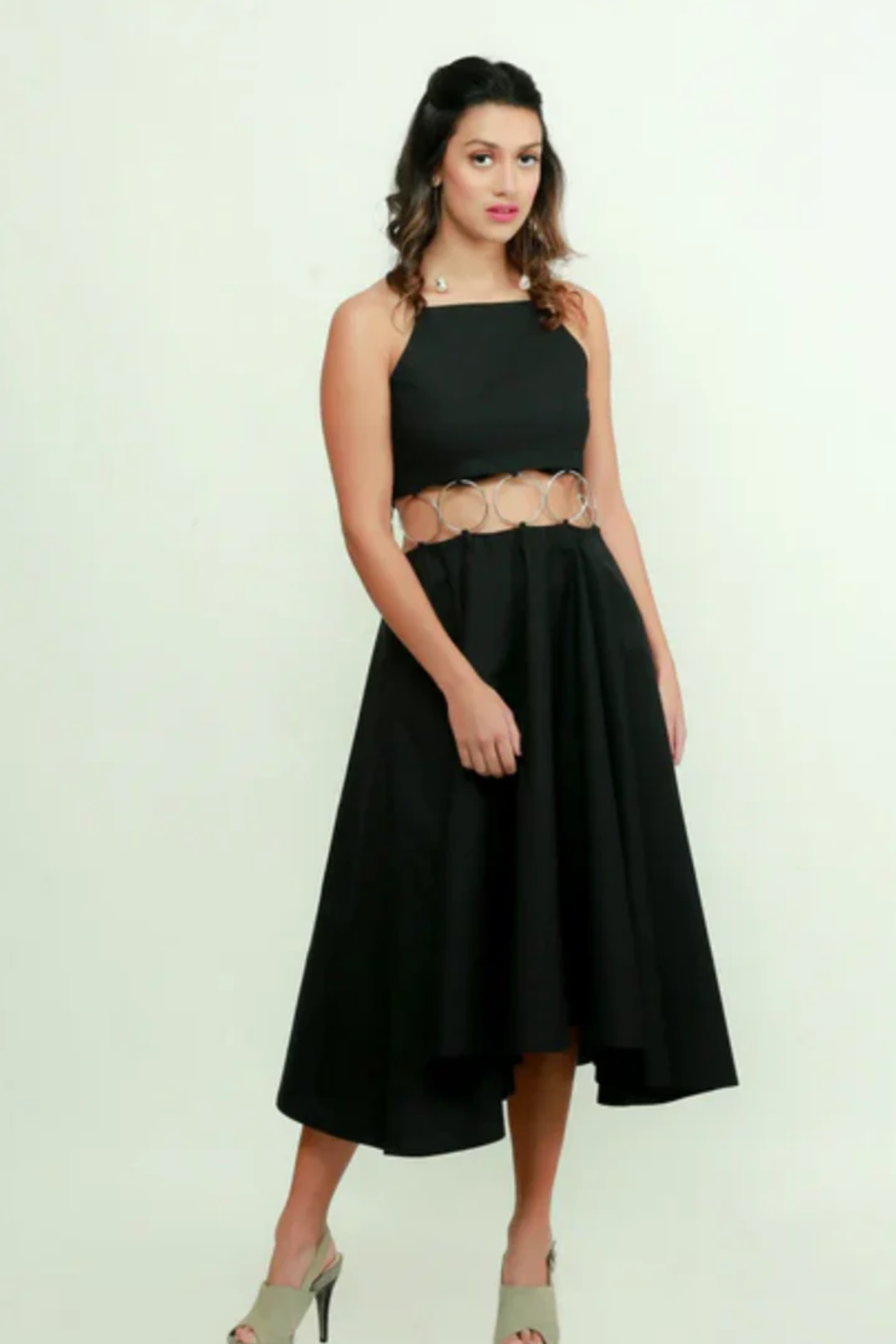 Black fit & flare midi dress features with ring detailing on the waist.