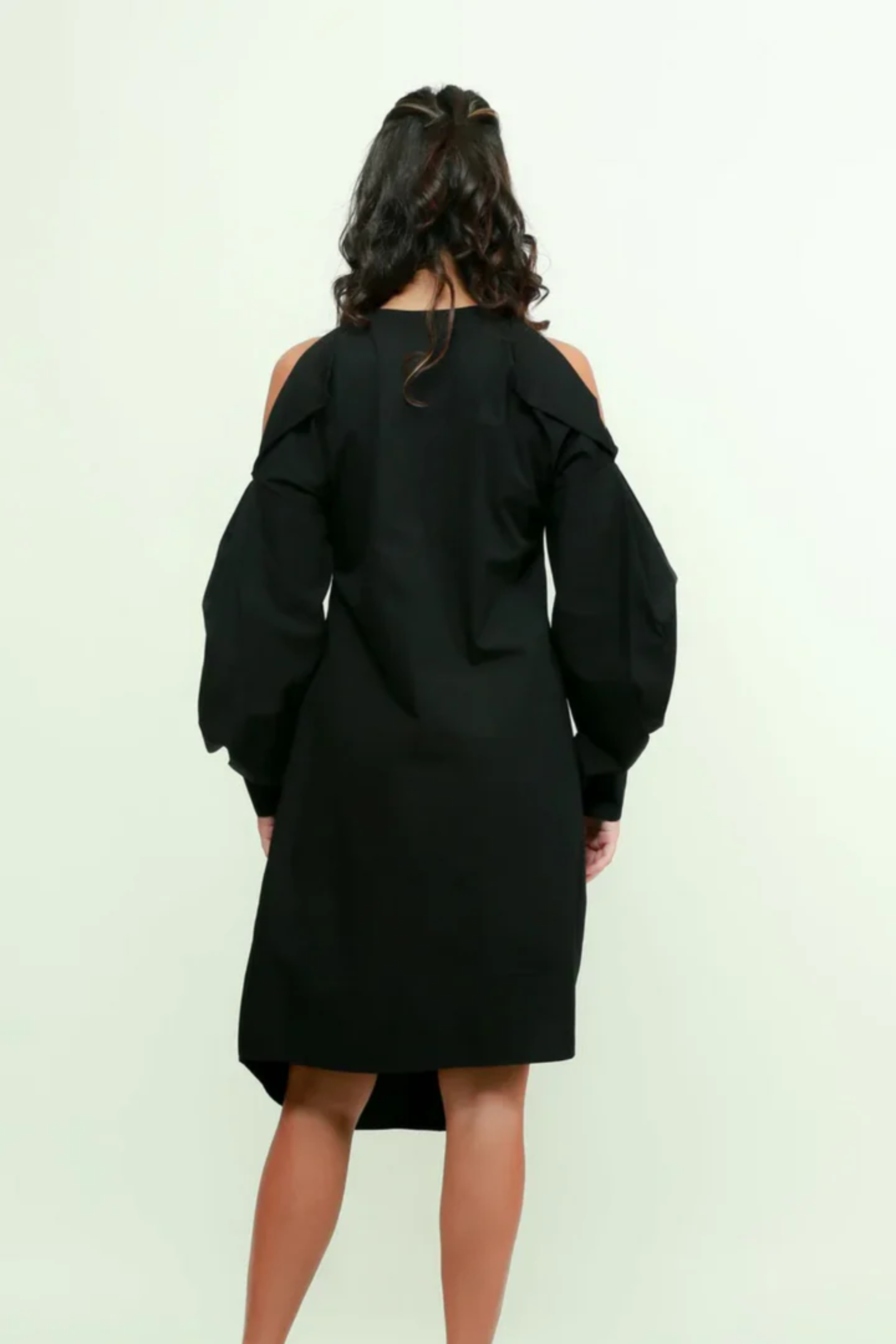 Black midi flap dress with pleated sleeves and an asymmetric placket detailing.
