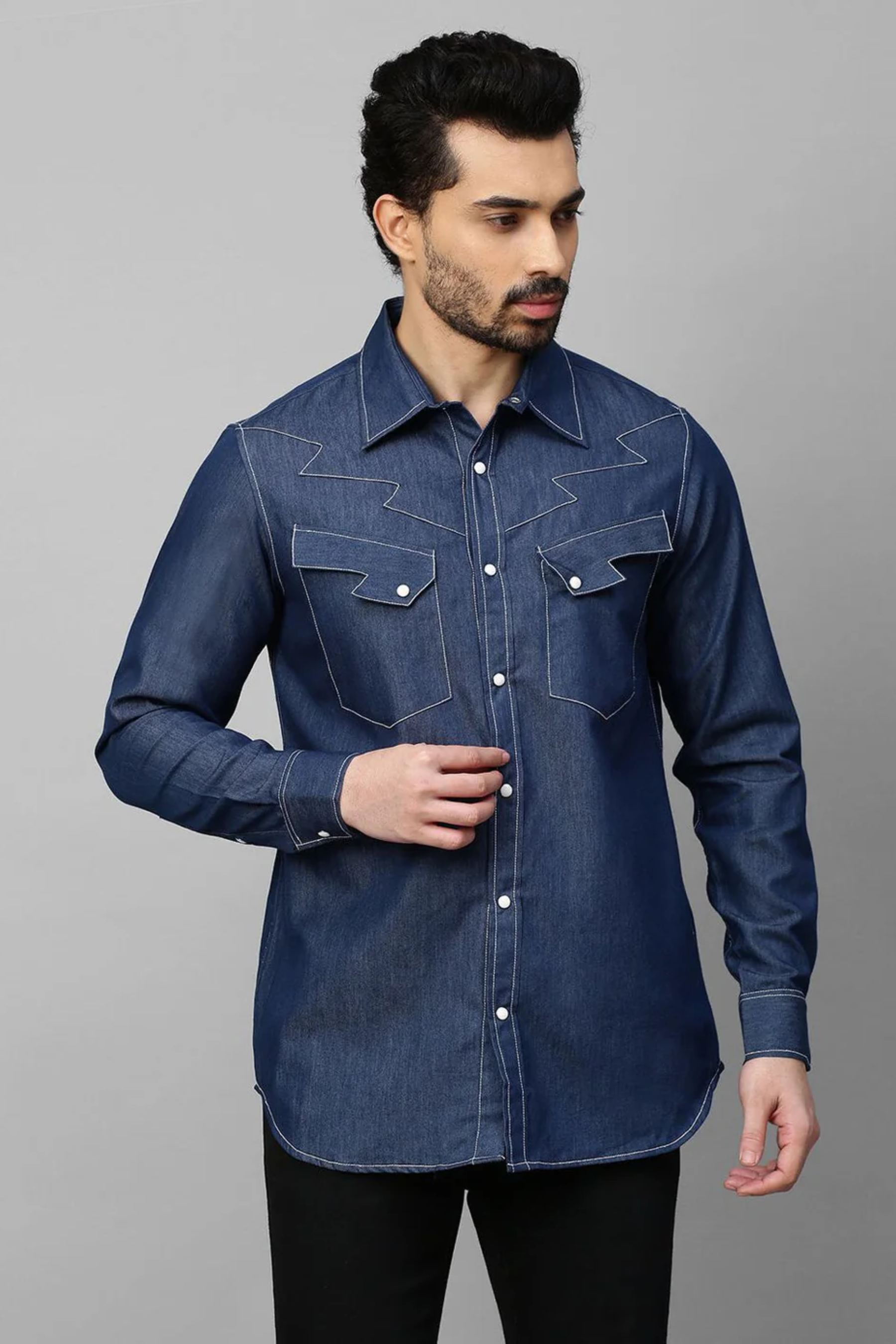 Denim shirt with contrast stitching feature.
