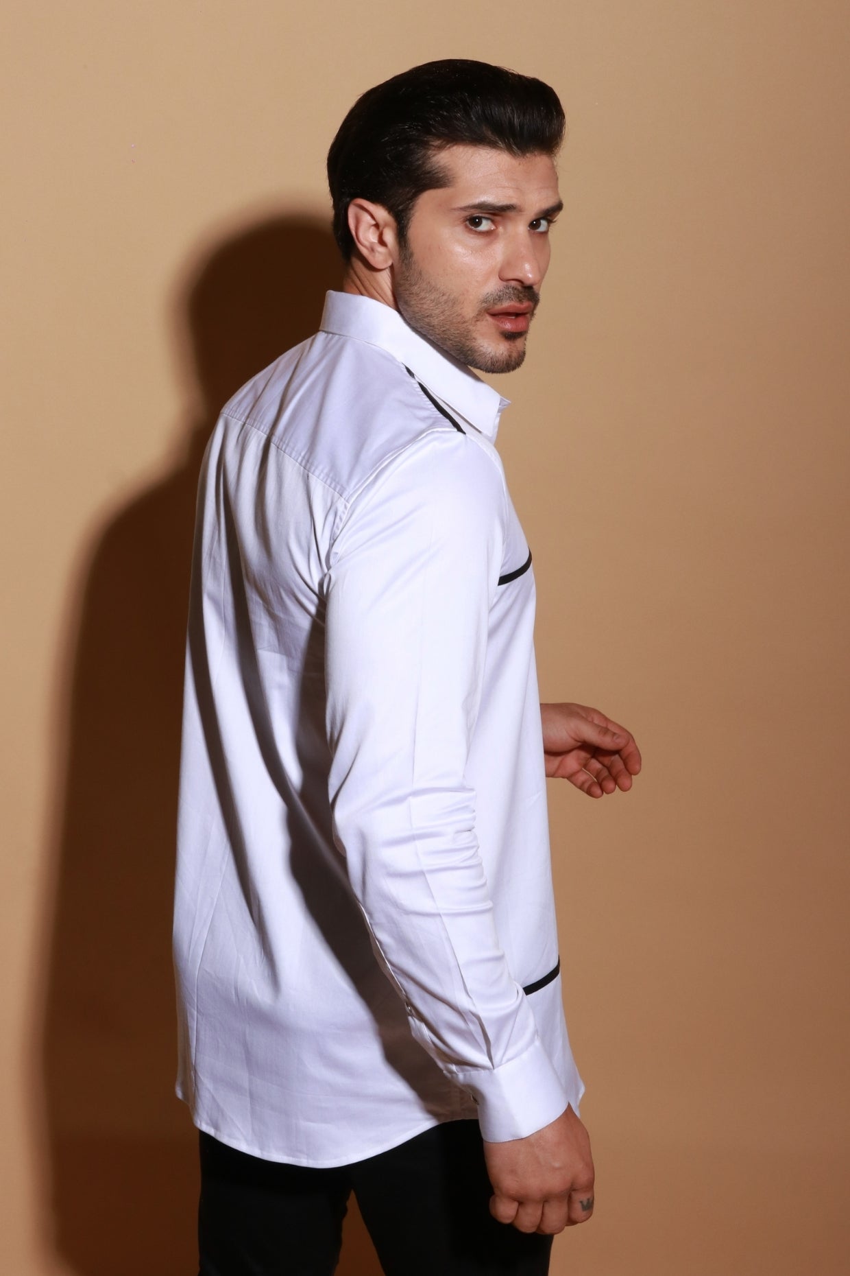 White classic shirt with contrast piping and pocket zipper detail.