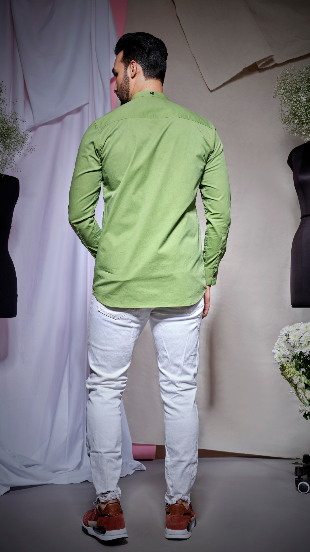 Moss green postman shirt with two pockets and placket flap feature with slant pocket