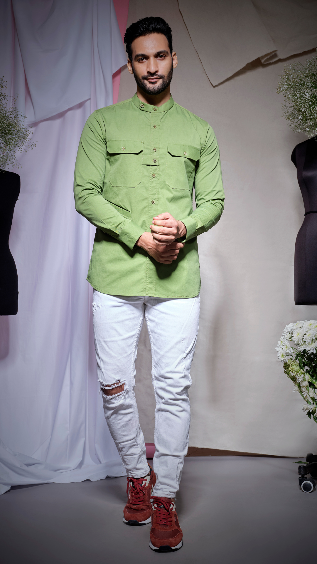 Moss green postman shirt with two pockets and placket flap feature with slant pocket