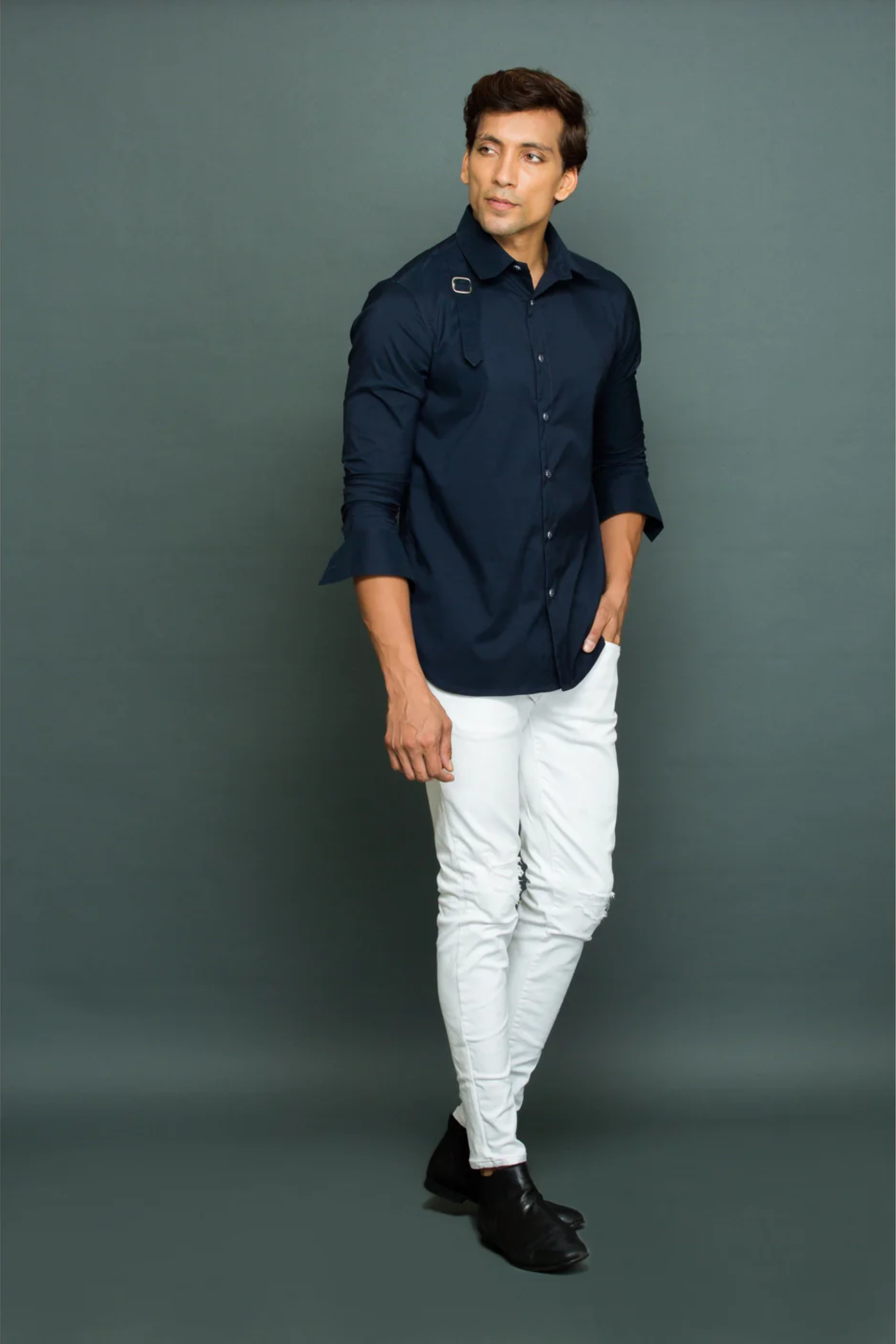 Blue shirt with harness detailing.