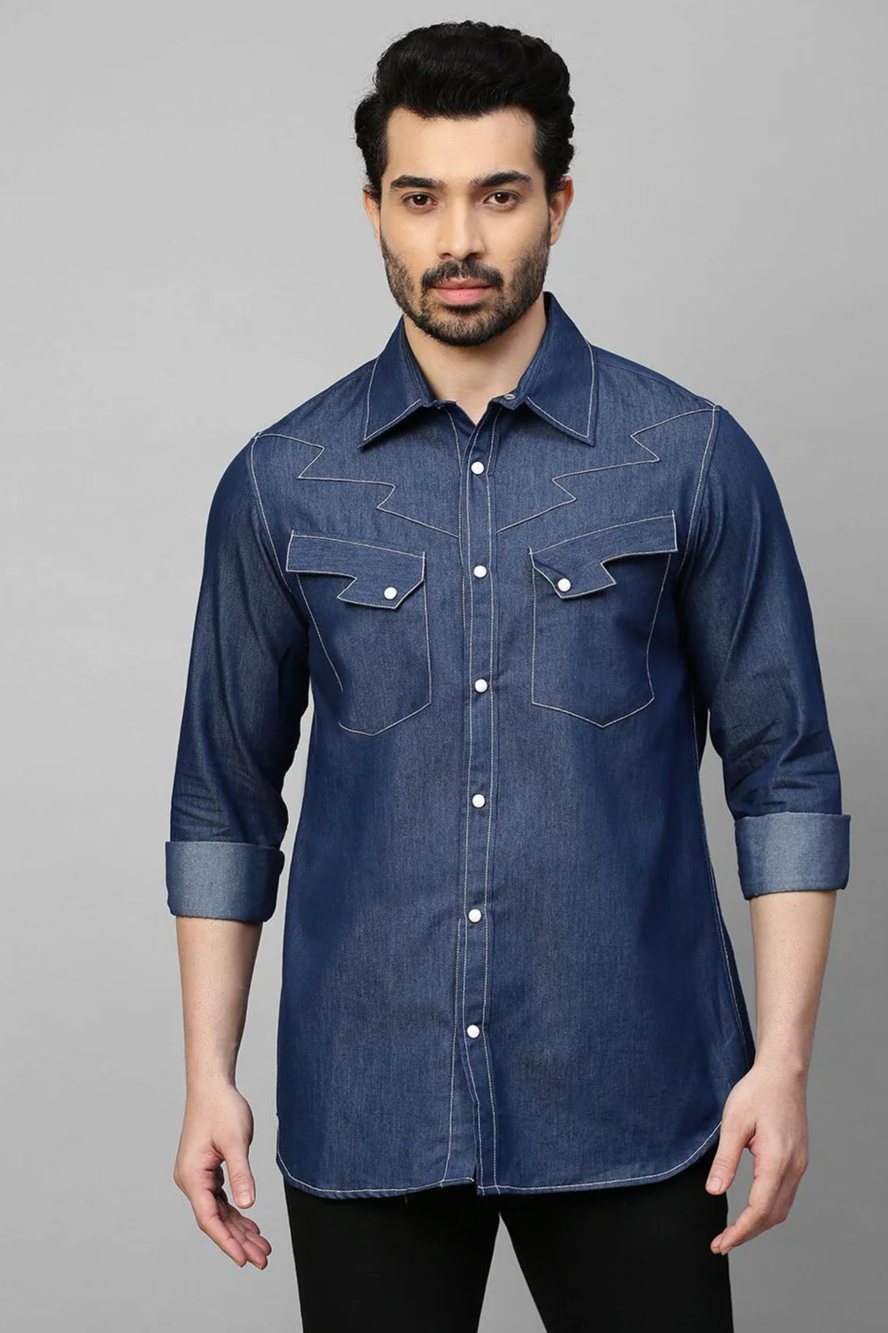 Denim shirt with contrast stitching feature.