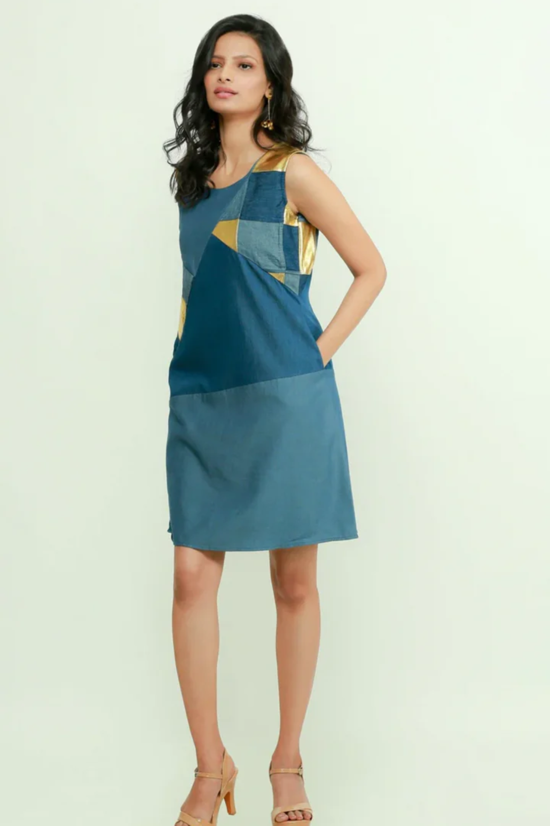 A-line denim dress with goldpatchwork.