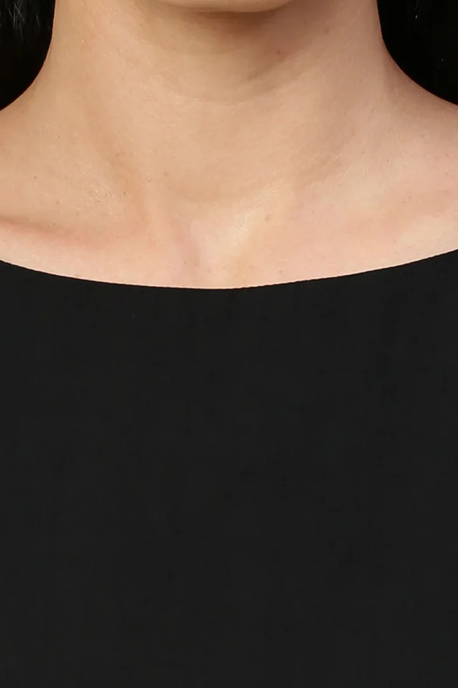 Black midi dress with tassel feature.
