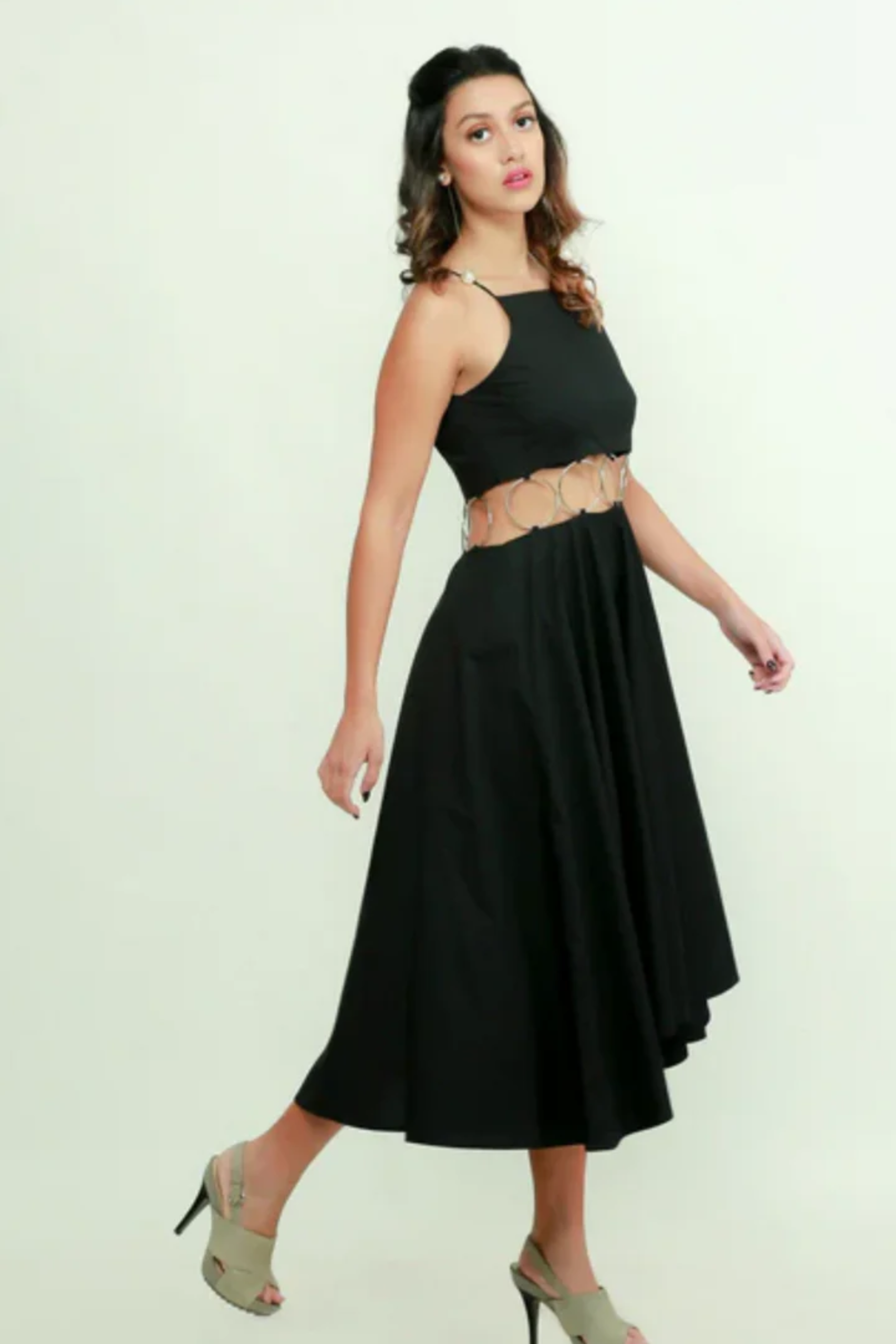 Black fit & flare midi dress features with ring detailing on the waist.