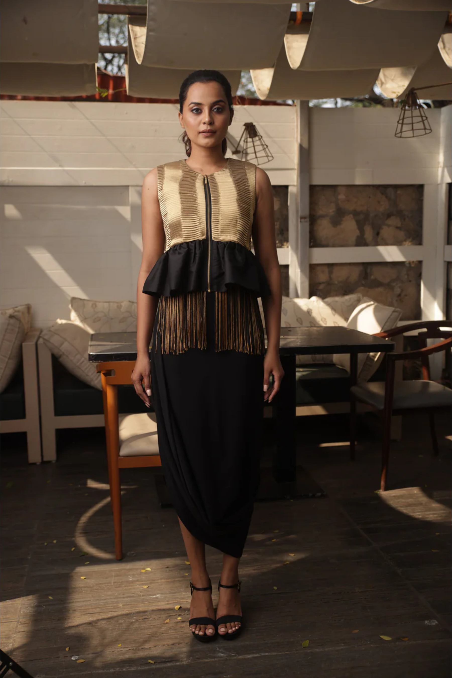 Gold tissue bolero jacket top with black and gold tassels.