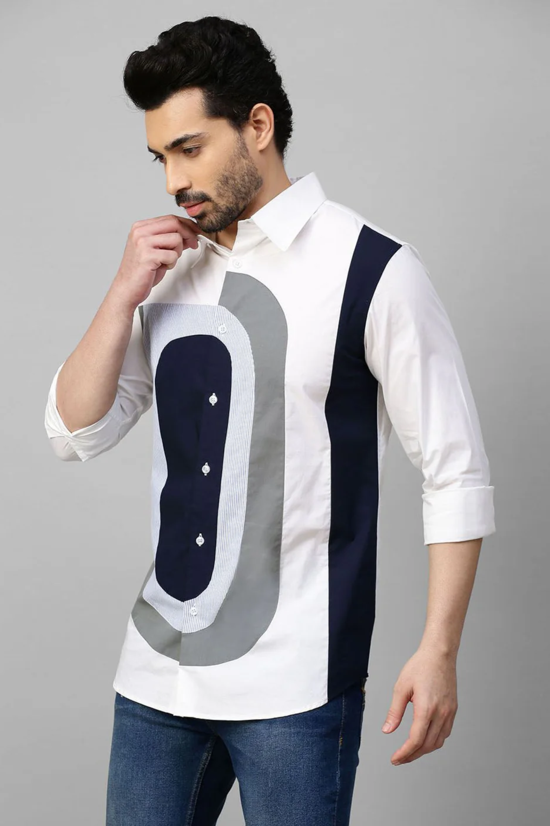 White shirt with color block patch detailing.