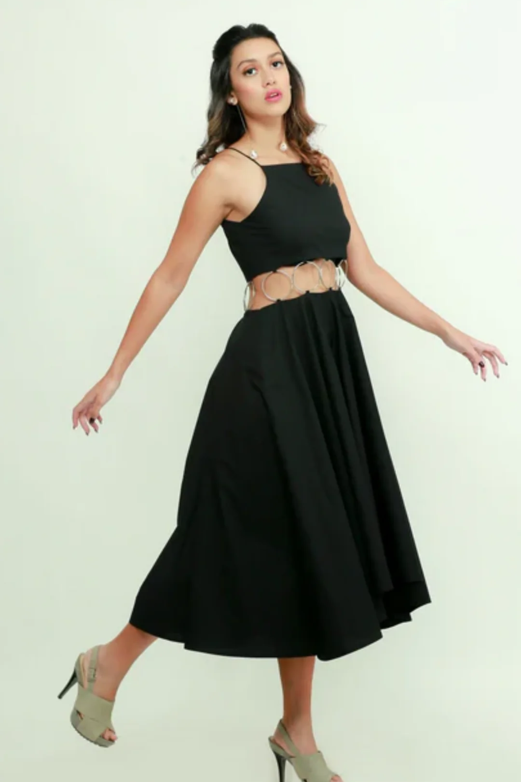 Black fit & flare midi dress features with ring detailing on the waist.