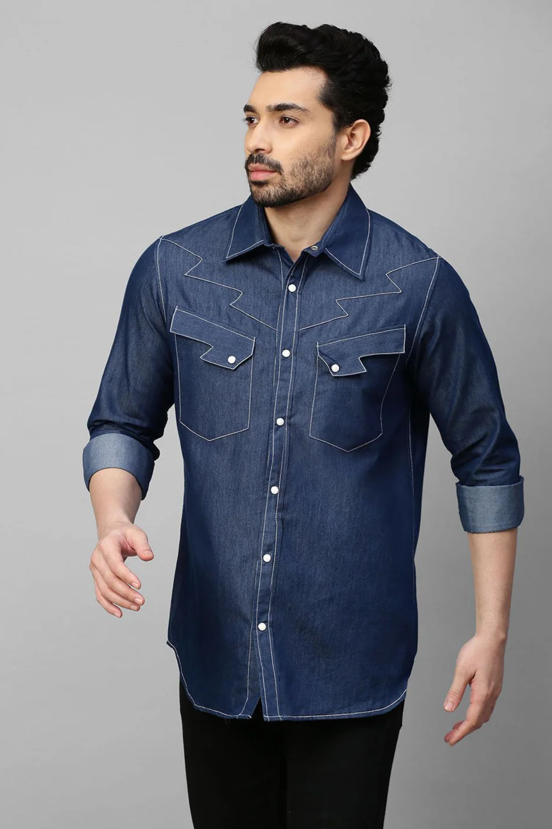 Denim shirt with contrast stitching feature.