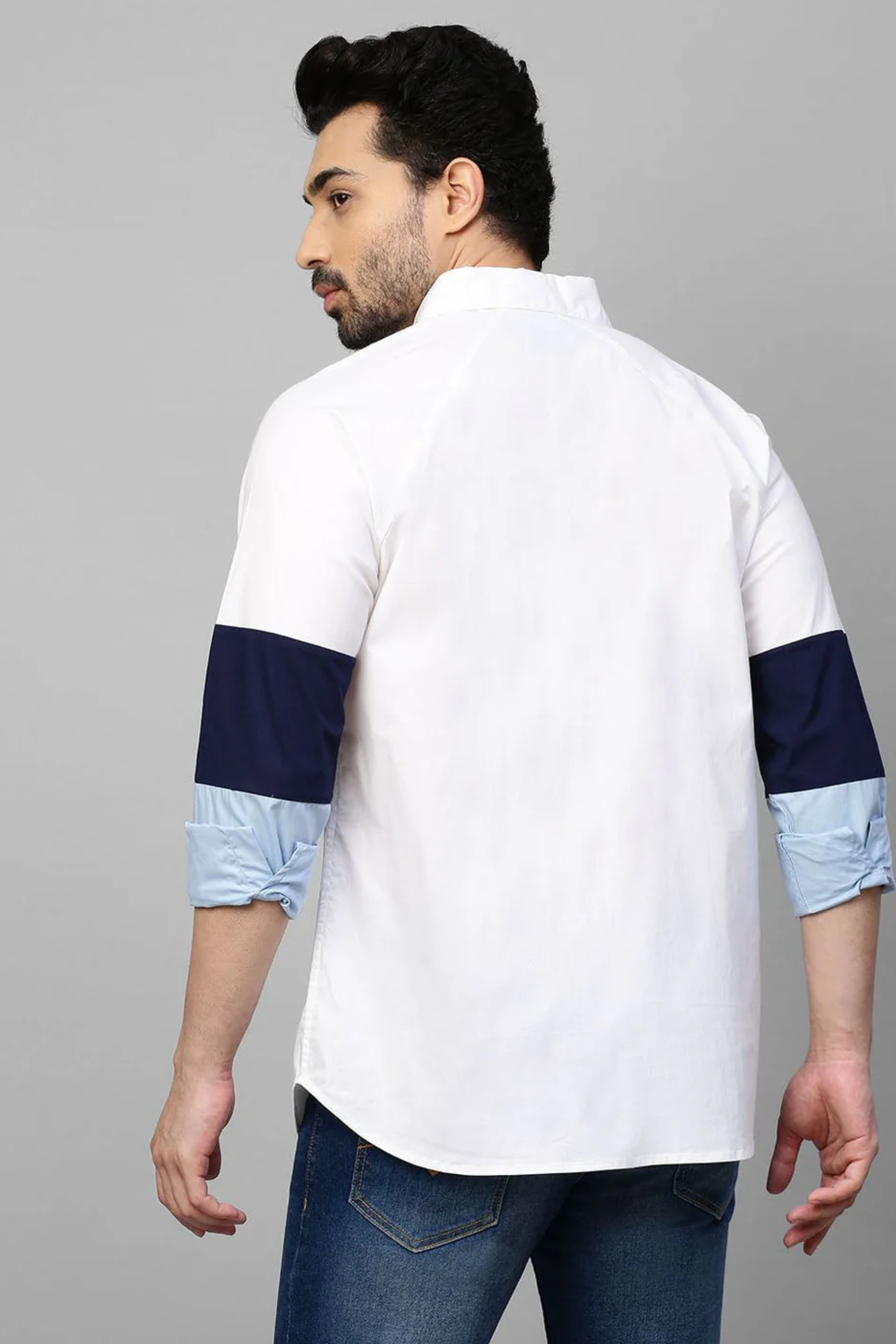 White shirt shades of blue band feature on sleeves.