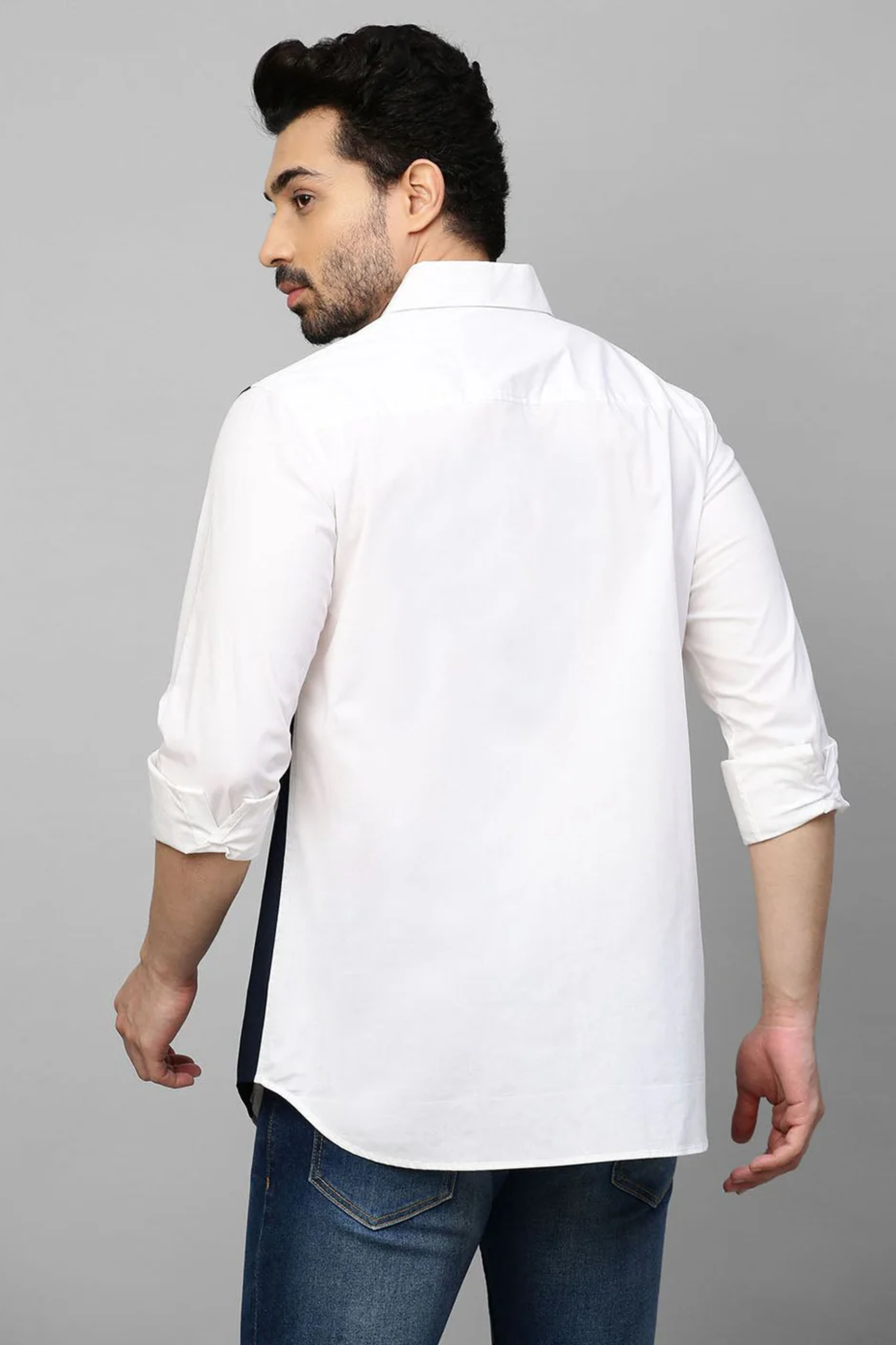 White shirt with color block patch detailing.