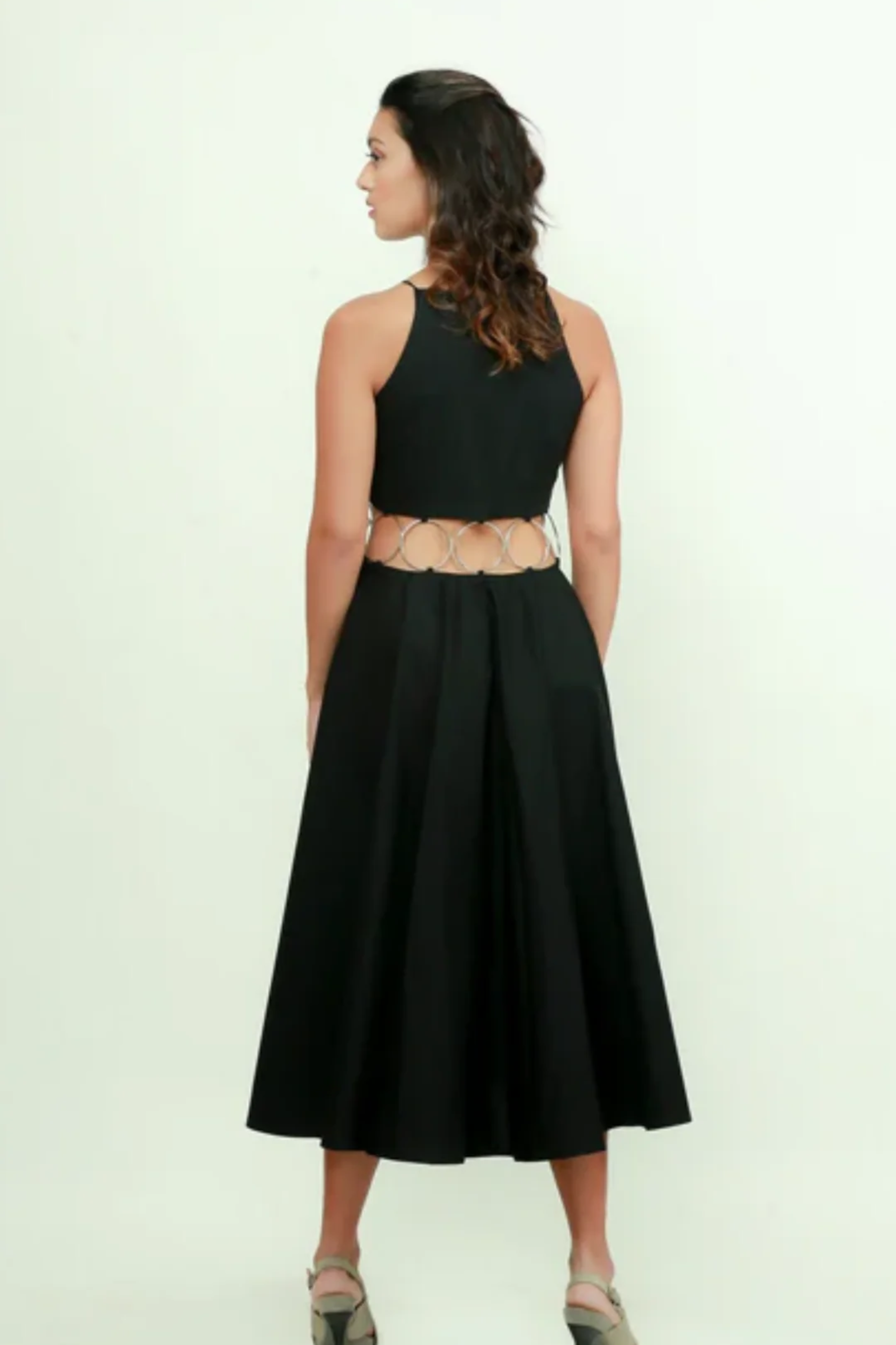 Black fit & flare midi dress features with ring detailing on the waist.