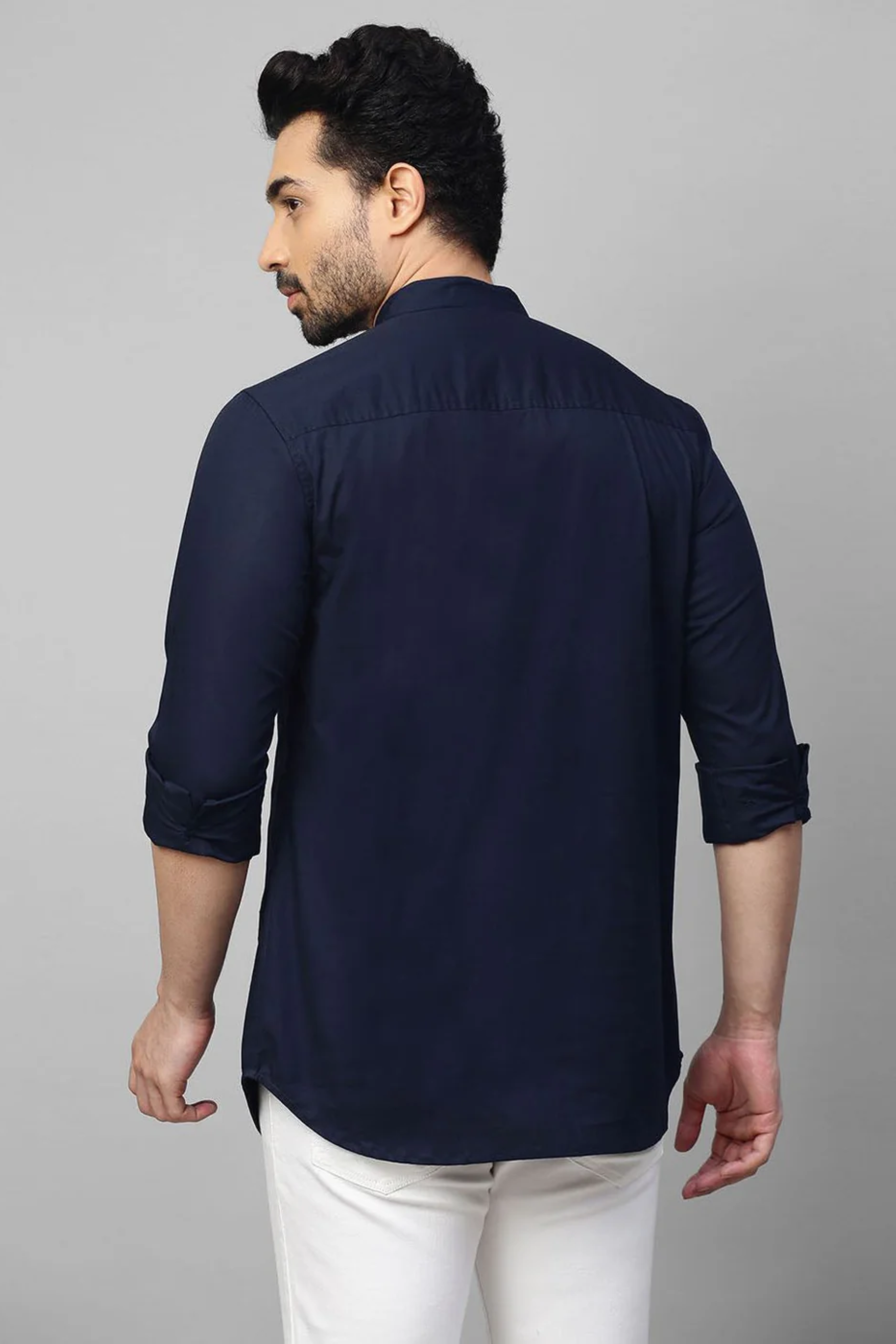 Blue mandarin collar shirt with half zipper detailing.