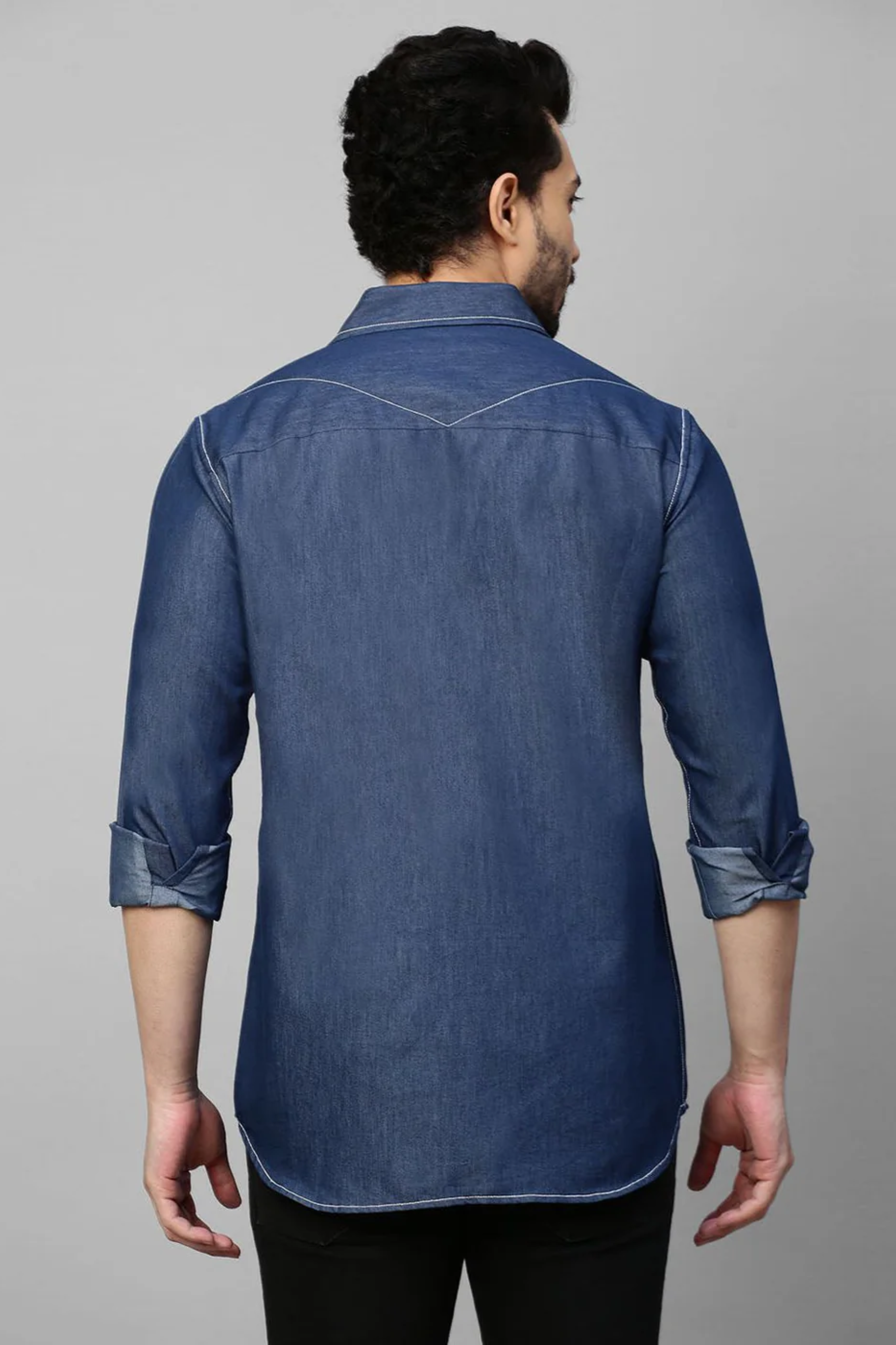 Denim shirt with contrast stitching feature.