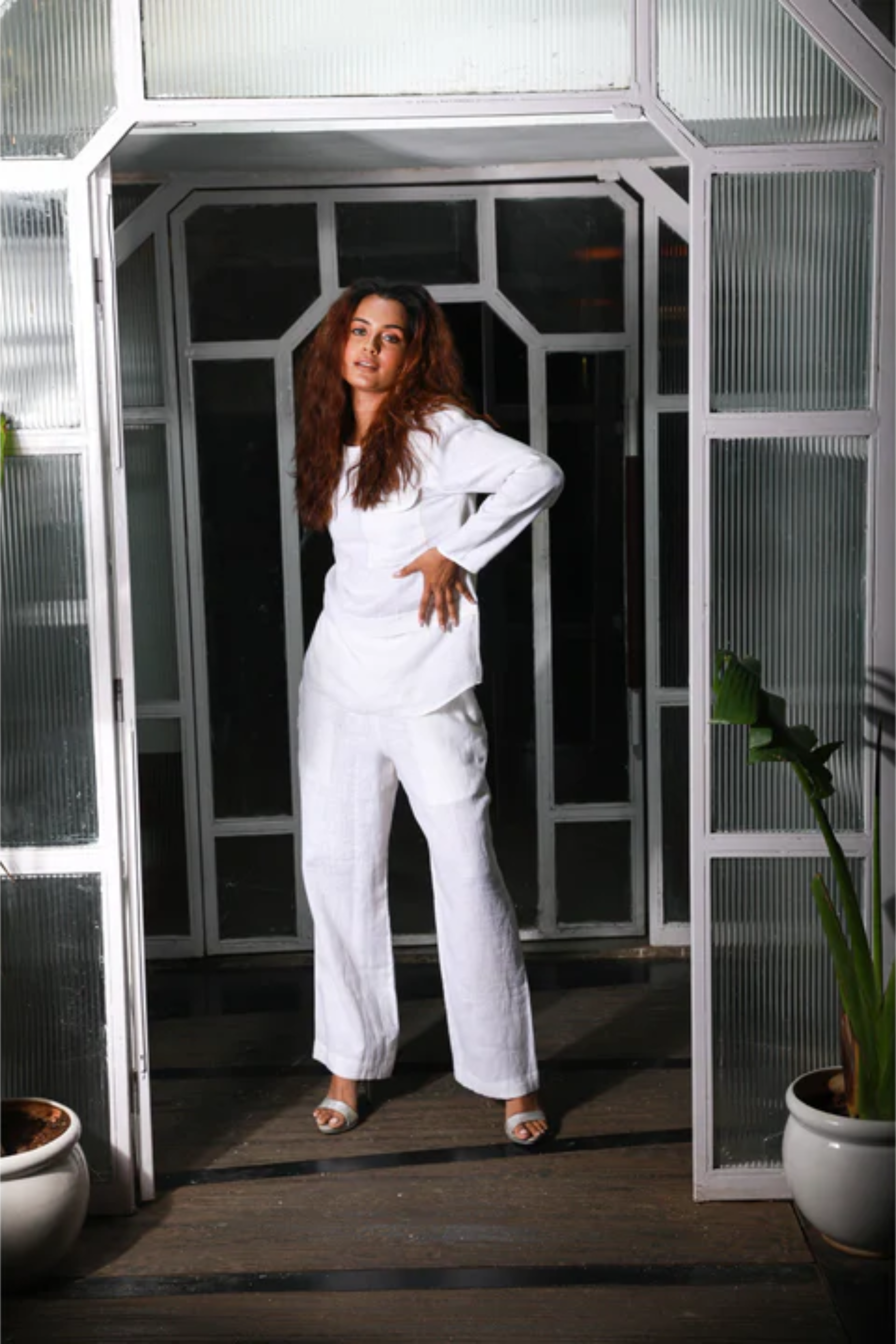 White linen co-ord set features a top with two pocket detailing and matching straight pants.