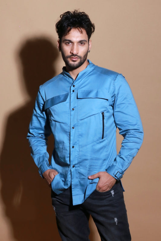 Slate blue shirt with extended pockets and zipper feature.