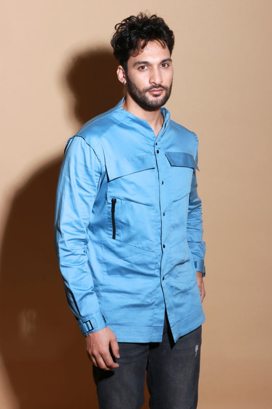 Slate blue shirt with extended pockets and zipper feature.