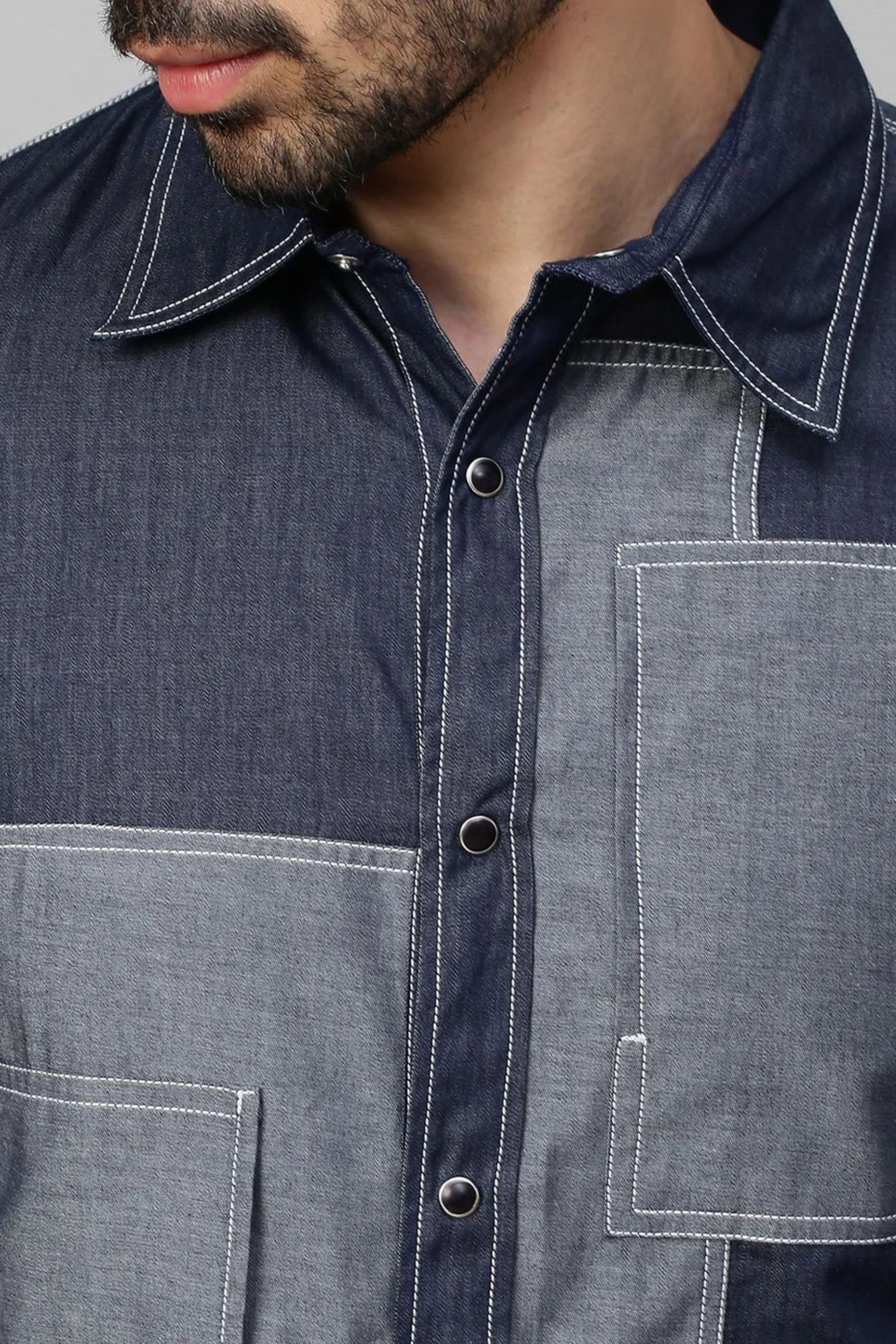 Blue Denim shirt with light denim patch work detailing.