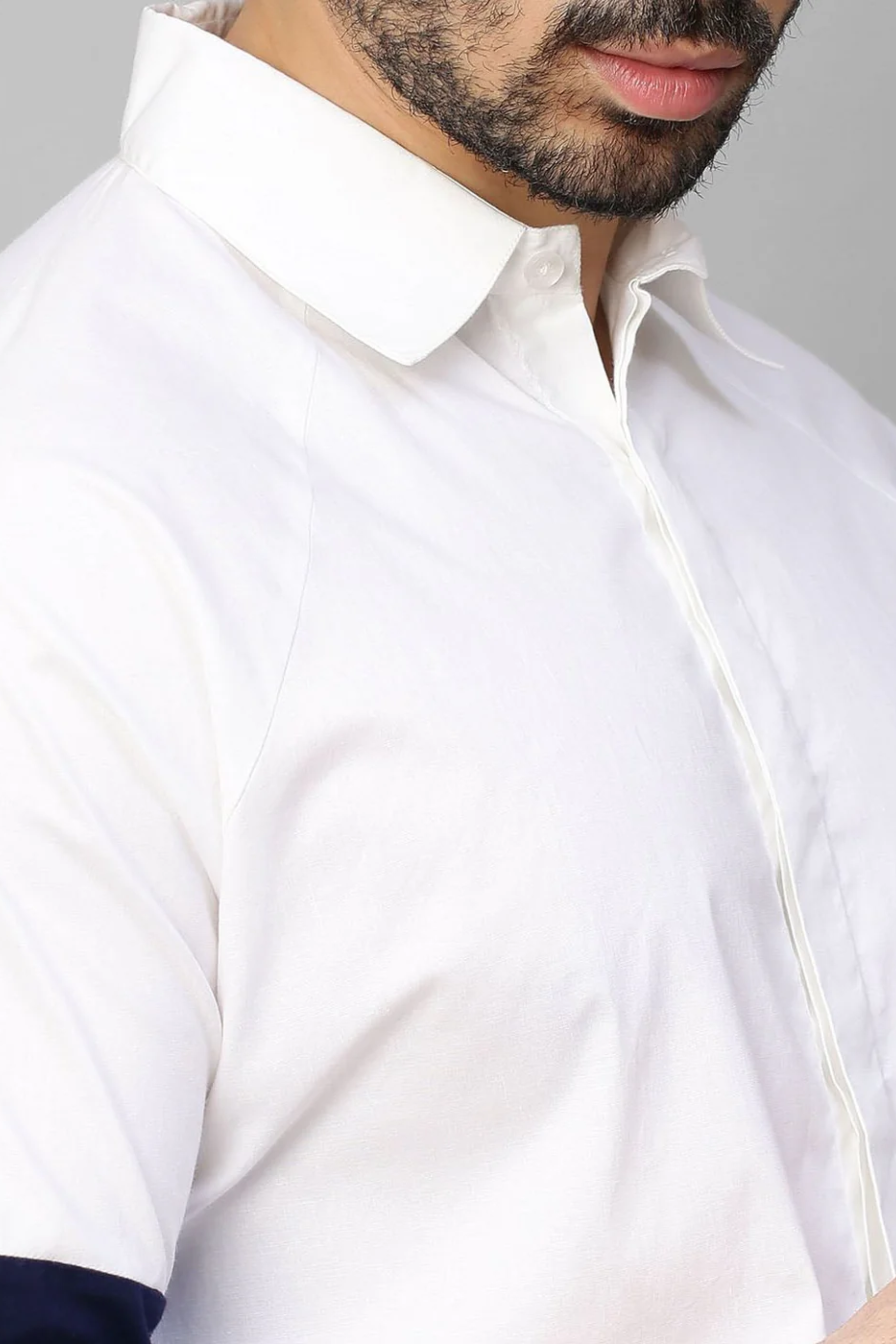 White shirt shades of blue band feature on sleeves.