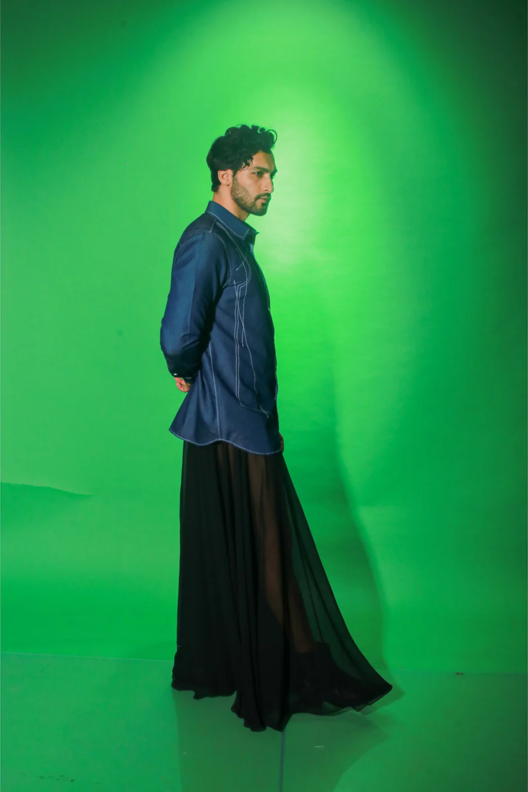 Denim shirt with abstract contrast stitching details.