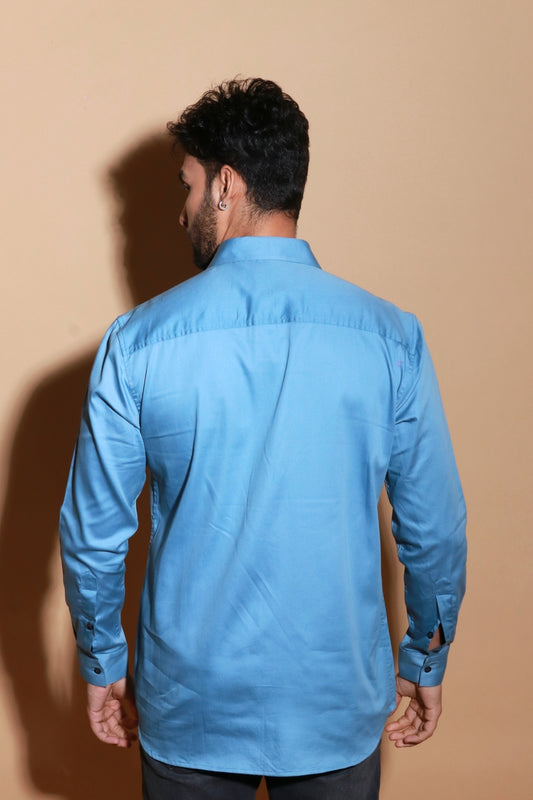 Slate blue shirt with extended pockets and zipper feature.