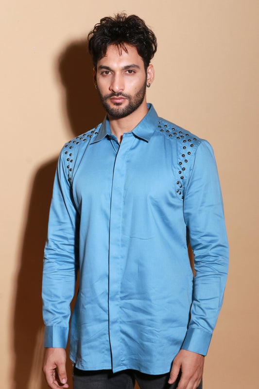 Slate blue classic shirt with rivet feature around shoulder.