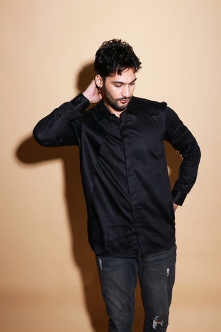 Black shirt with one side slant feature.