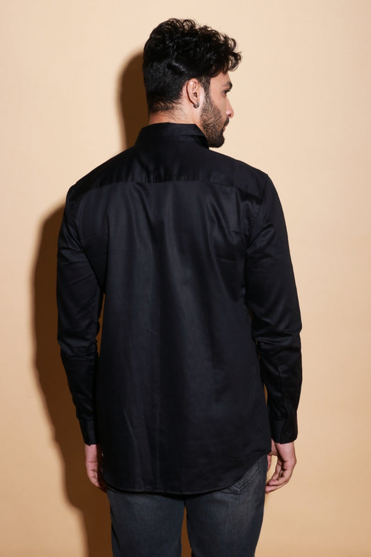 Black shirt with one side slant feature.