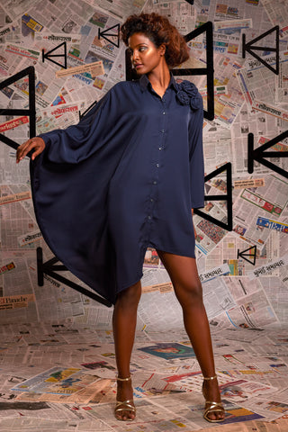 Blue rayon asymmetrical shirt with one side kaftan sleeve feature.