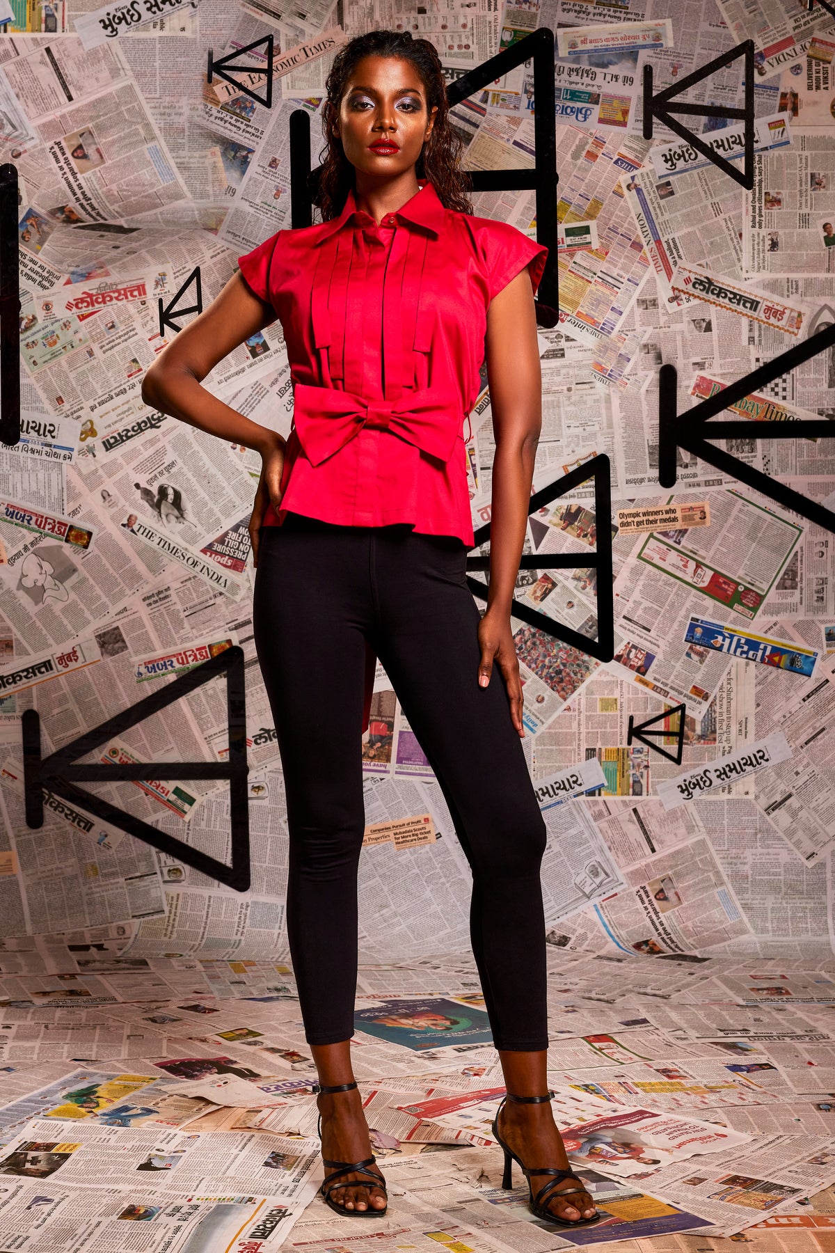 Maroon pearl lycra Sleeveless pleated shirt with detachable bow.