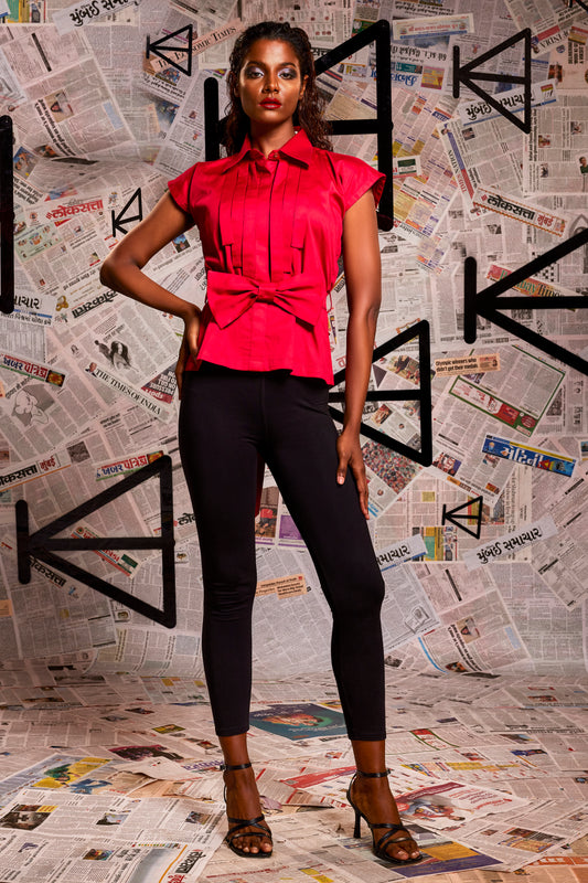 Maroon pearl lycra Sleeveless pleated shirt with detachable bow.