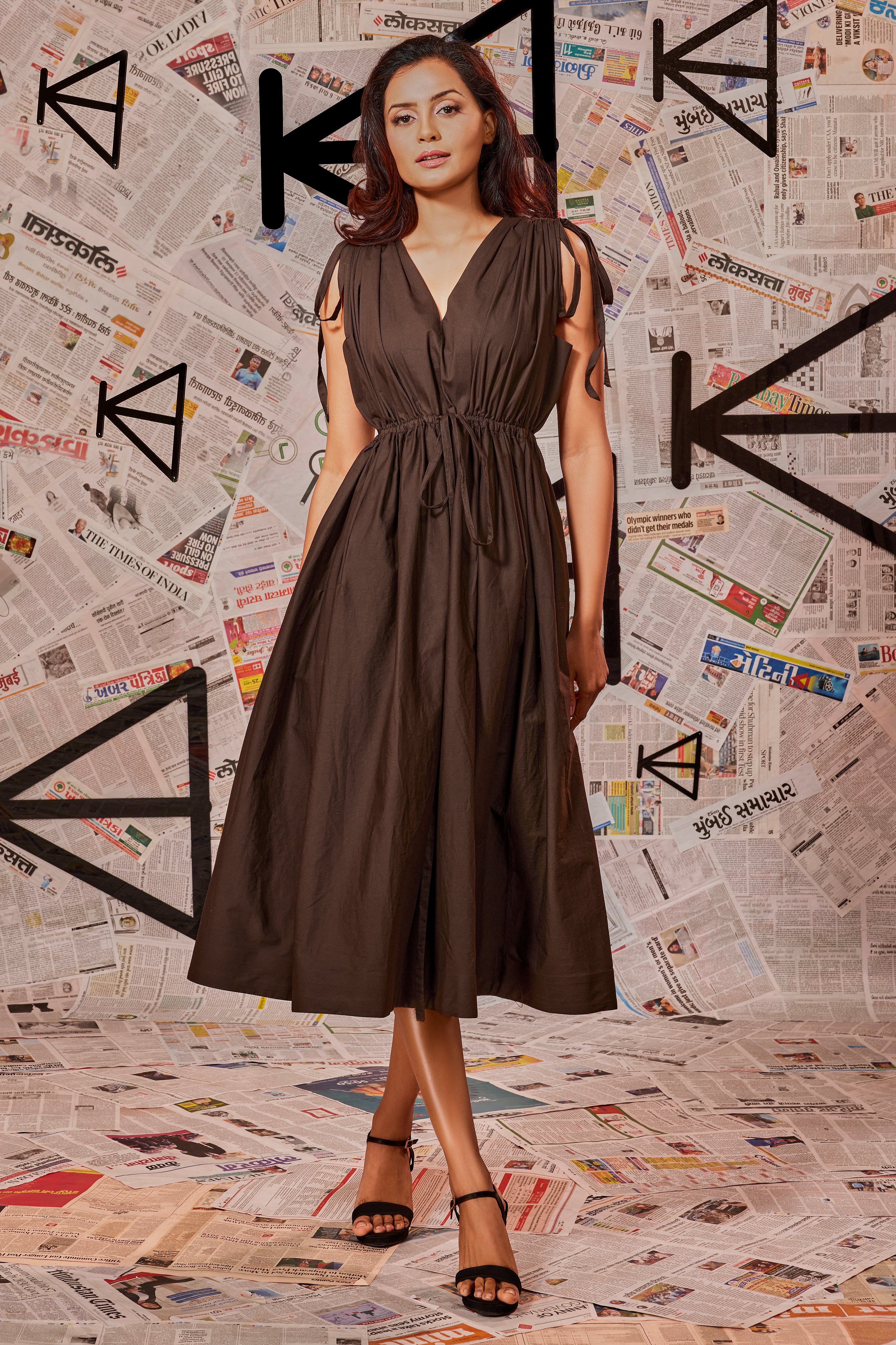 Choclate brown dress with ruching at the waist and shoulders and two side pockets.