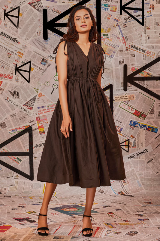 Choclate brown dress with ruching at the waist and shoulders and two side pockets.