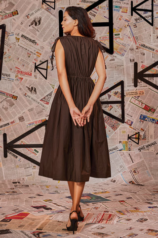 Choclate brown dress with ruching at the waist and shoulders and two side pockets.